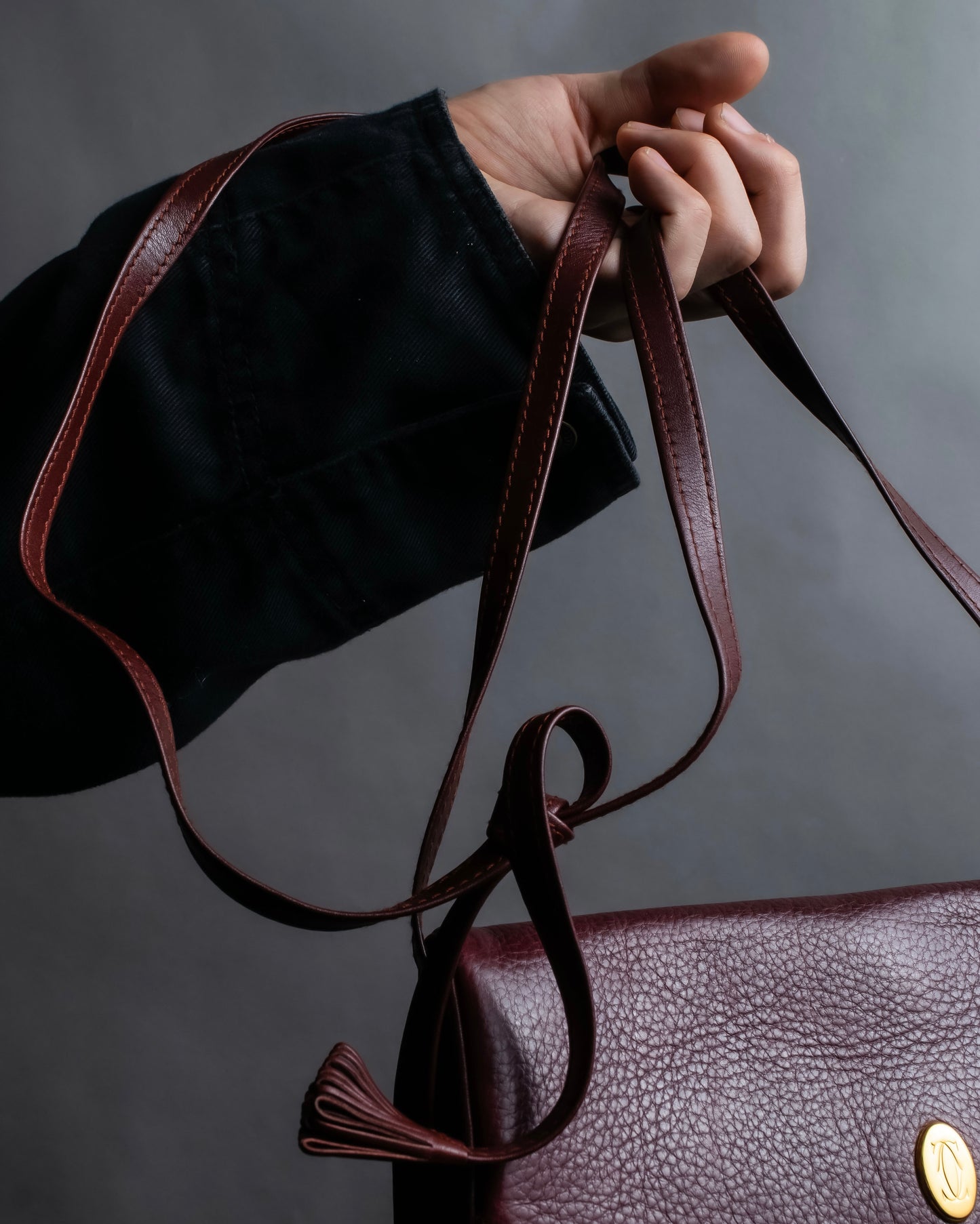 "Cartier" Texture changing bordeaux colored leather shoulder bag