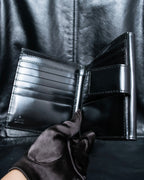 "GUCCI" Canvas and leather bi-fold wallet