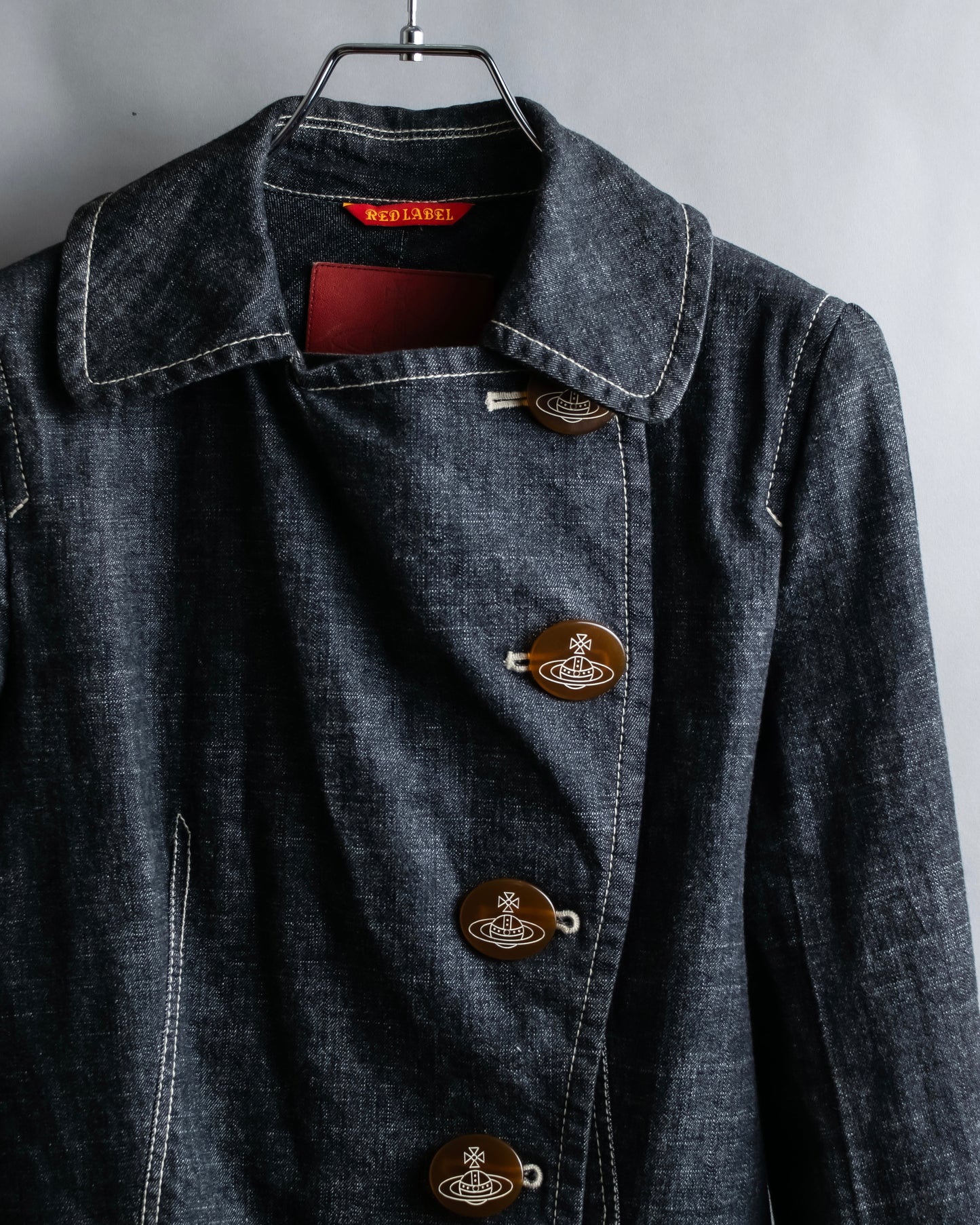 "Vivienne Westwood RED LABEL" Asymmetrical button design mid length denim coat