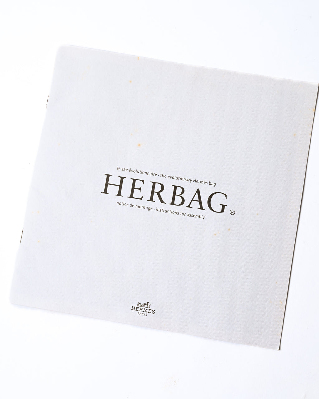 トップパーツと織物製ボディを取り外して組み立てる手順を記した、旧型Herbag用の説明書。表紙には「HERBAG」と組み立て説明の表記が確認できます。