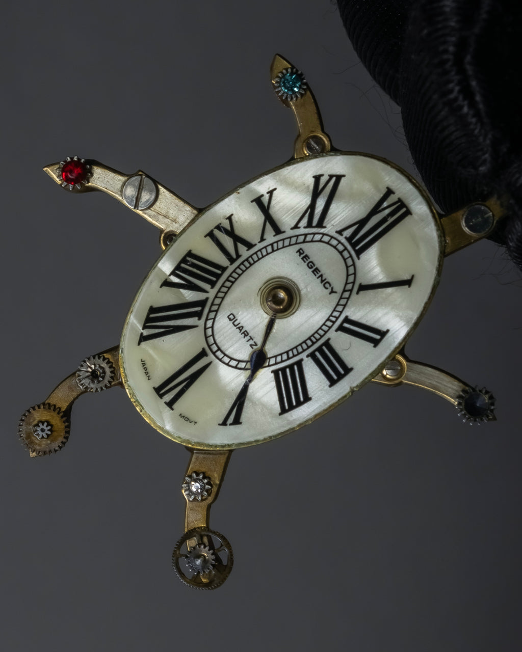 "Jerry Robertson design clock motif brooch"