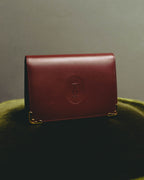 “Cartier” 90’s Must de Cartier burgundy embossed leather bifold wallet