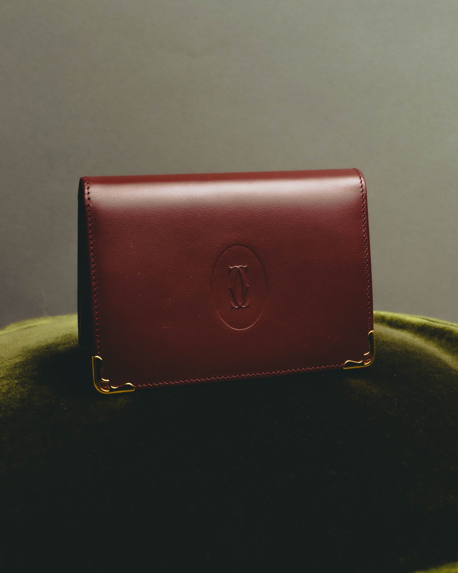 “Cartier” 90’s Must de Cartier burgundy embossed leather bifold wallet