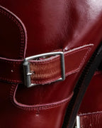 "tricot COMME des GARCONS"
 Belted heel leather pumps