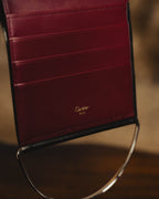 "Cartier" 80's Sculptural ring-handle leather wallet