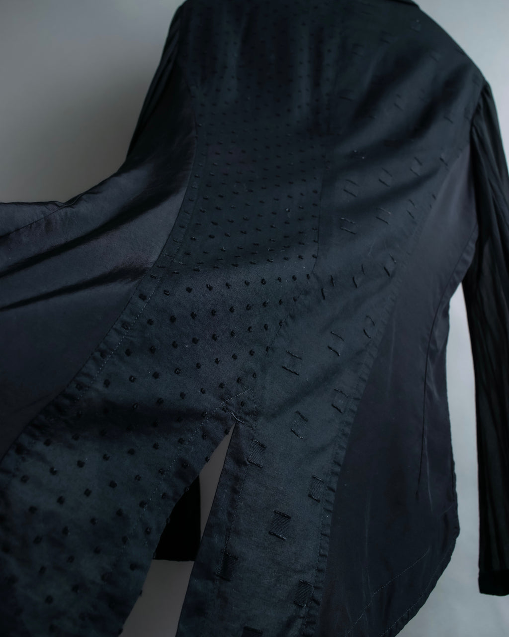 “Y’s COMPOSITION: SEE ATTACHED LABEL” Layered design multi buttons tail coat