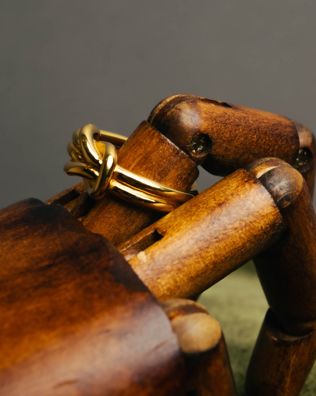 "HERMES" Sculptural gold tone knot Atame scarf ring