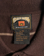 首元に配されたFB COUNTYのネックラベルと品質表示タグのカット。表記サイズ1XL、綿60％・アクリル40％の混紡ニットを確認できます。
