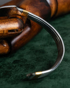 "Christian Dior" Ribbed design gold combination polished silver bangle