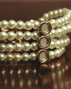 –SPECIAL– “Christian Dior” 2018-2025 Four-strand faux pearl bracelet with sculptural oval accents
