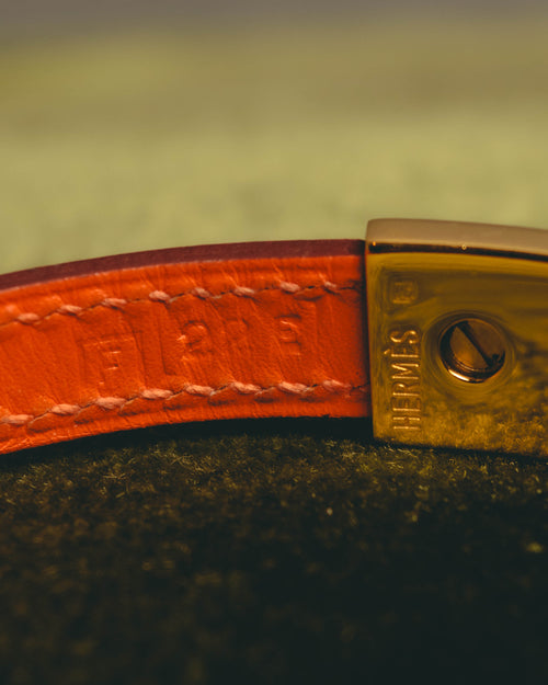 "Hermès" 00's Vibrant orange leather bracelet