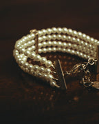 –SPECIAL– “Christian Dior” 2018-2025 Four-strand faux pearl bracelet with sculptural oval accents