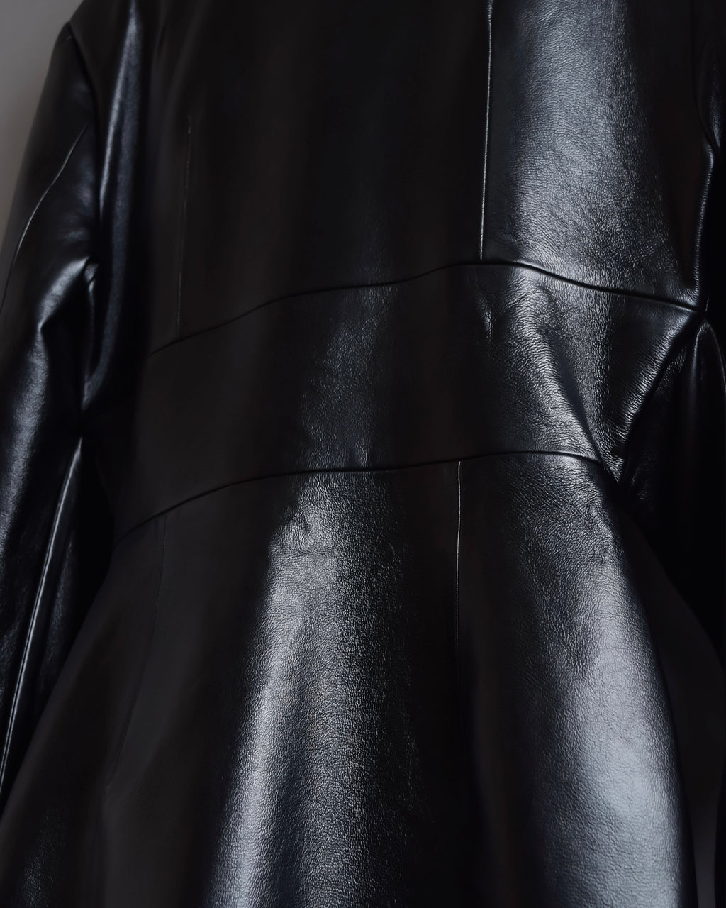 "MATÉRIEL TBILISI" Draped belted synthetic leather long jacket