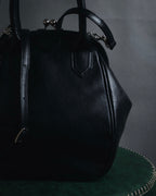 "Y’s" 22AW sculptural kiss-lock leather bag