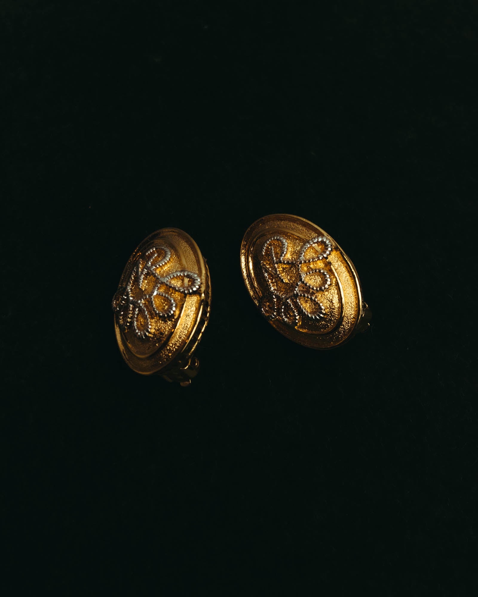 “Nina Ricci” 80's-90's Gold-tone floral clip-on earrings