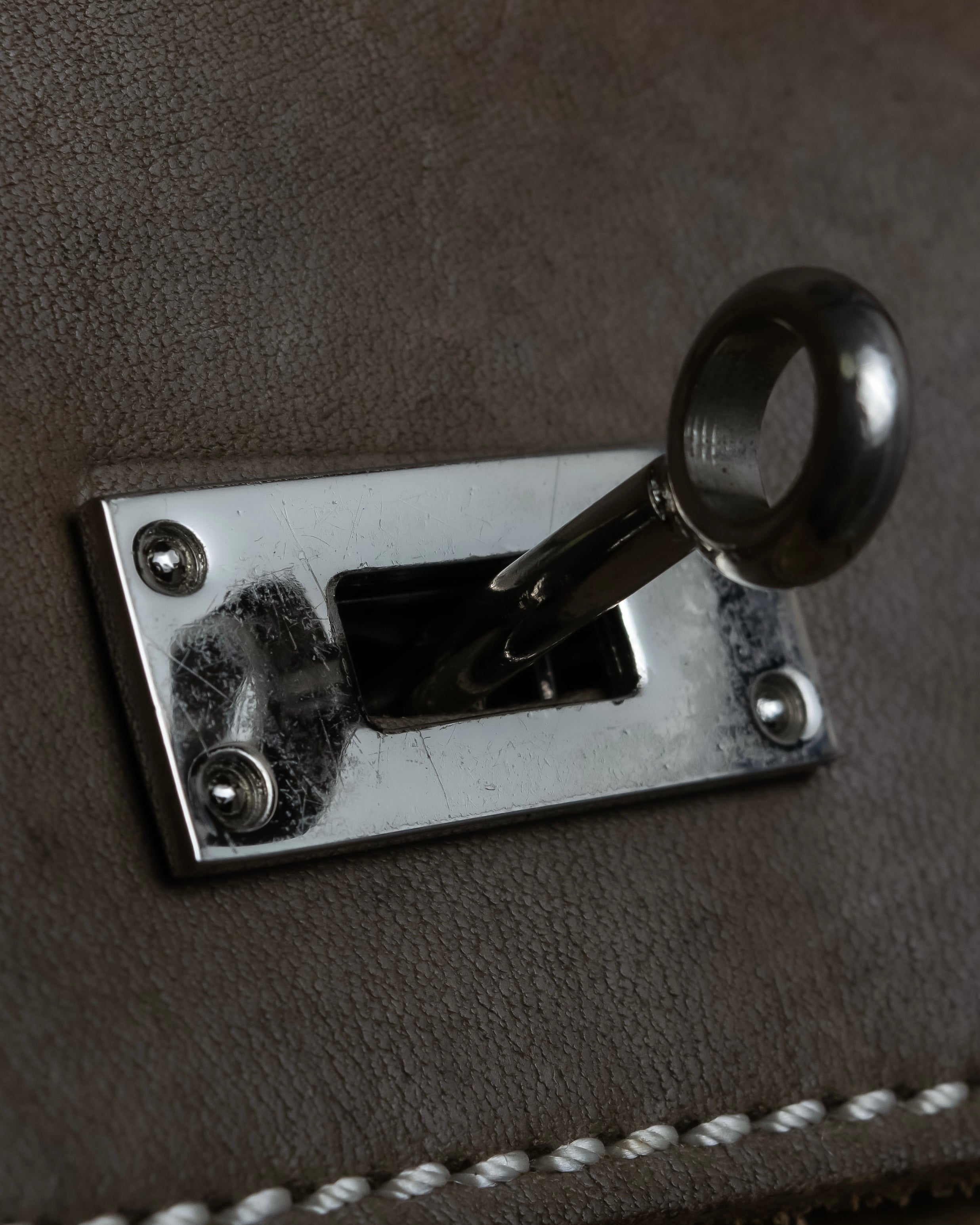 "Mademoiselle Accessories"
 Silver parts design leather one handle bag