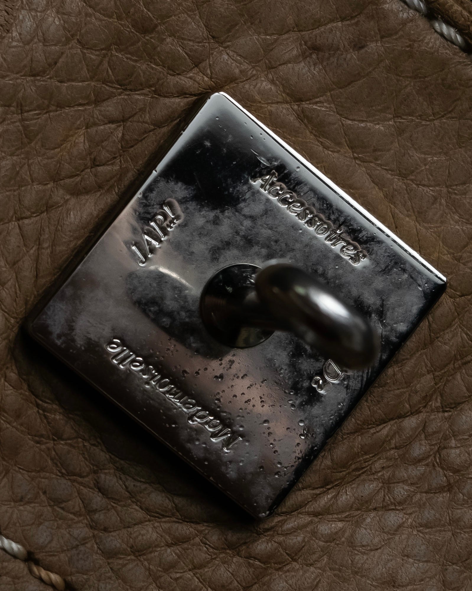 "Mademoiselle Accessories"
 Silver parts design leather one handle bag