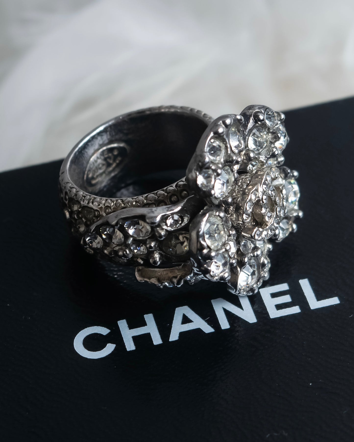 "CHANEL" Cocomark engraved rhinestone design camellia ring