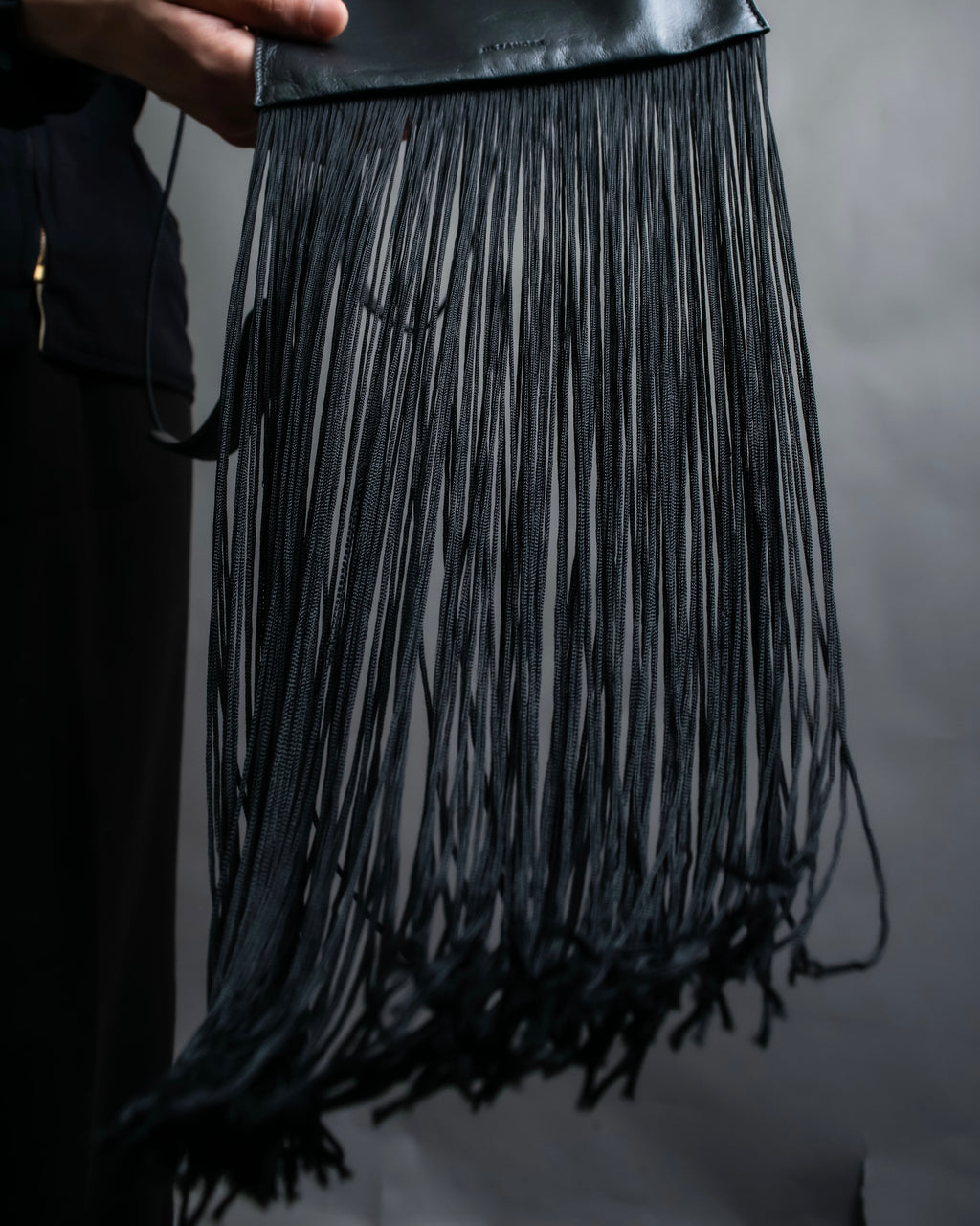 “JIL SANDER” Fringe detail flat drawstring shoulder bag