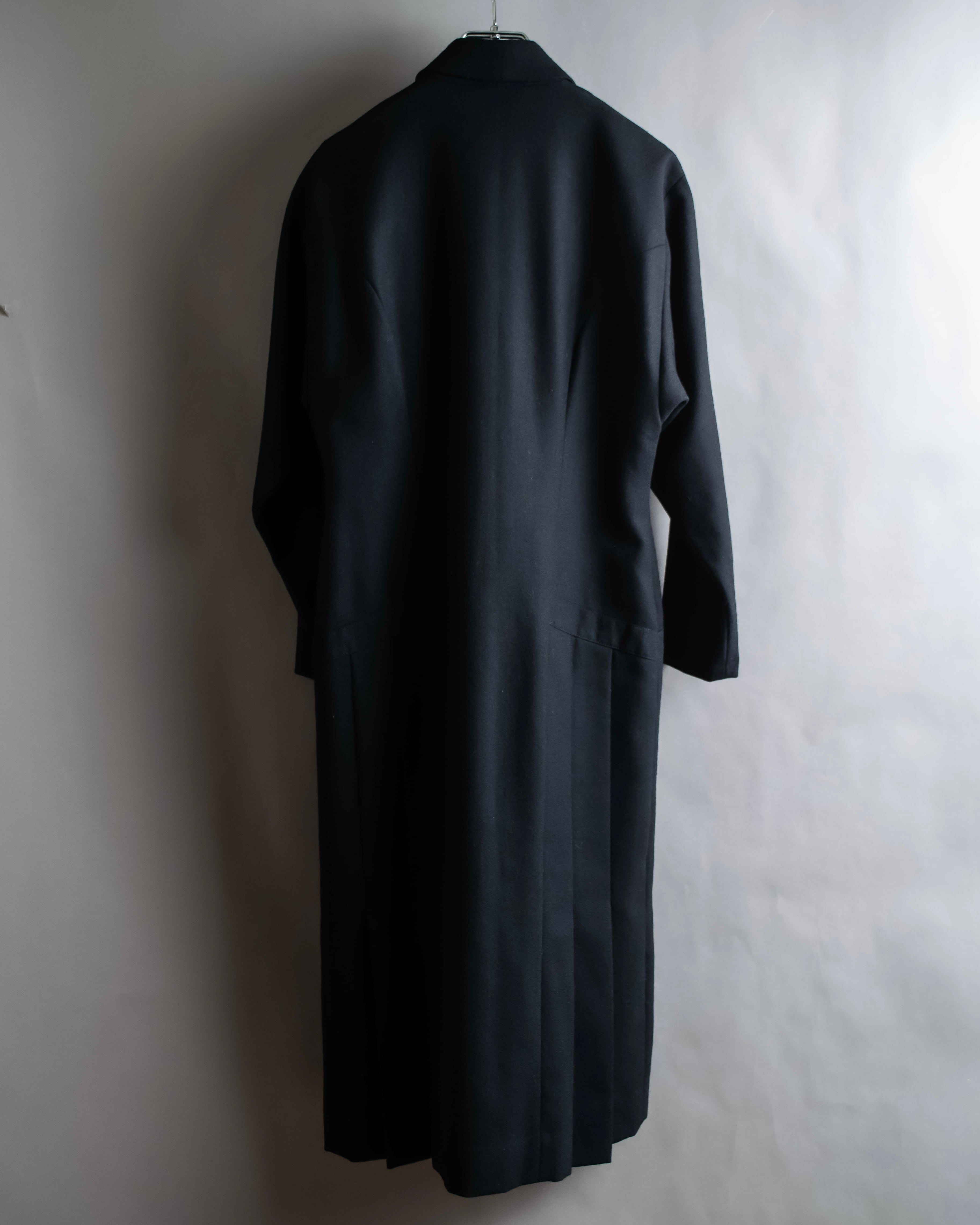 Tight-waisted wool shirt and black coat