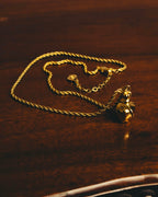 "Christian Dior" 80's-90's Gold tone bottle pendant necklace