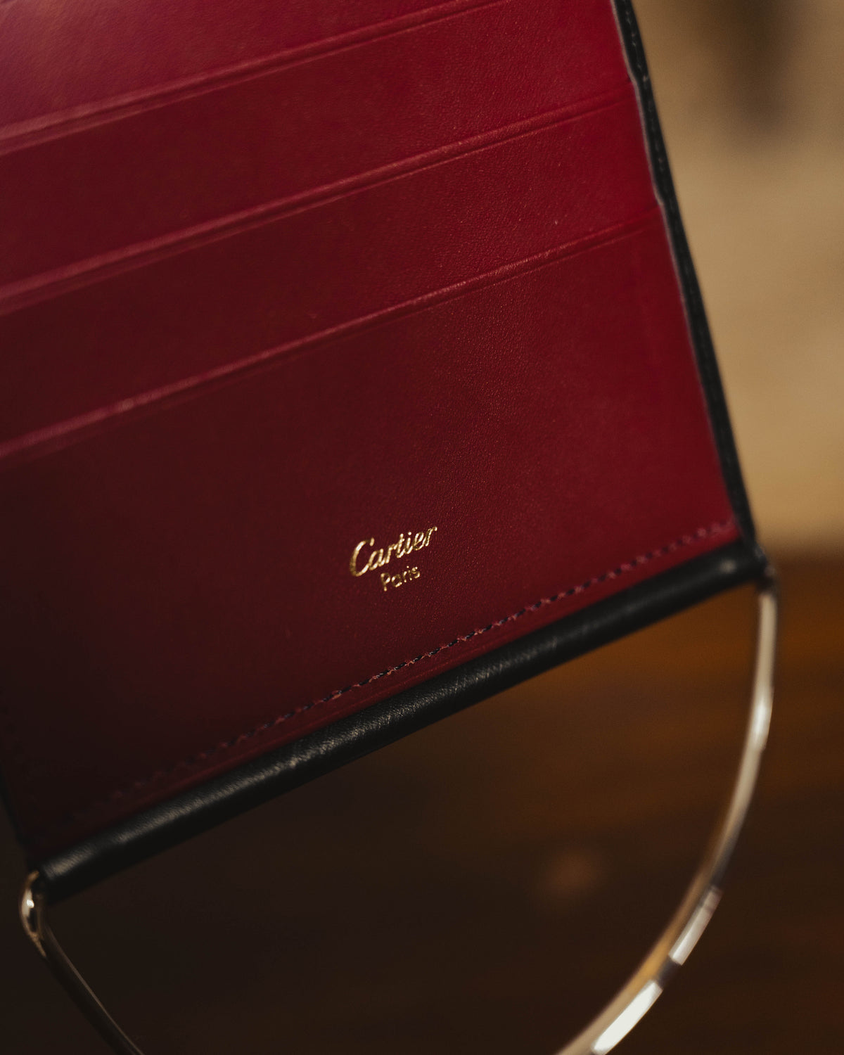 "Cartier" 80's Sculptural ring-handle leather wallet