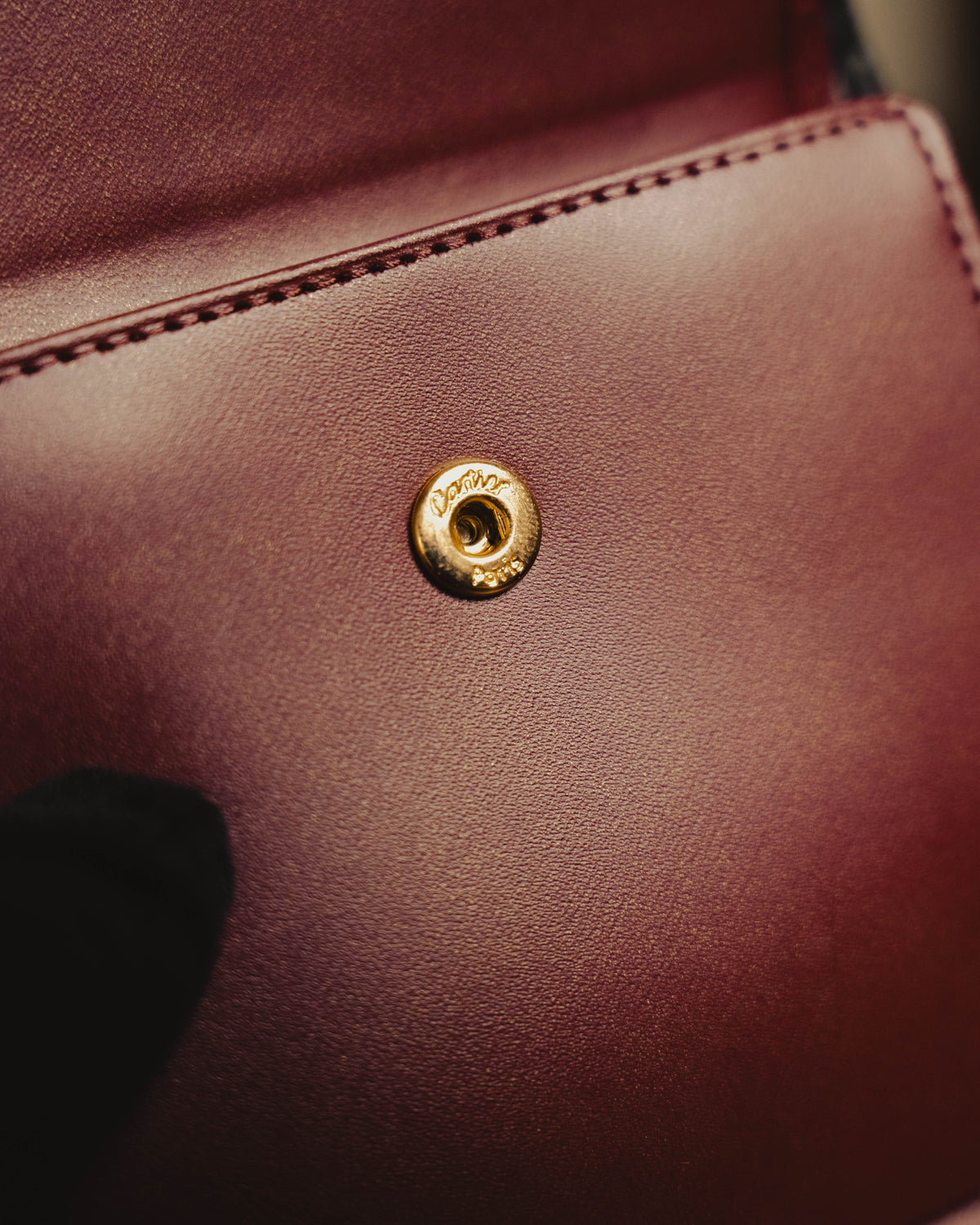 "Cartier" 80's Sculptural ring-handle leather wallet