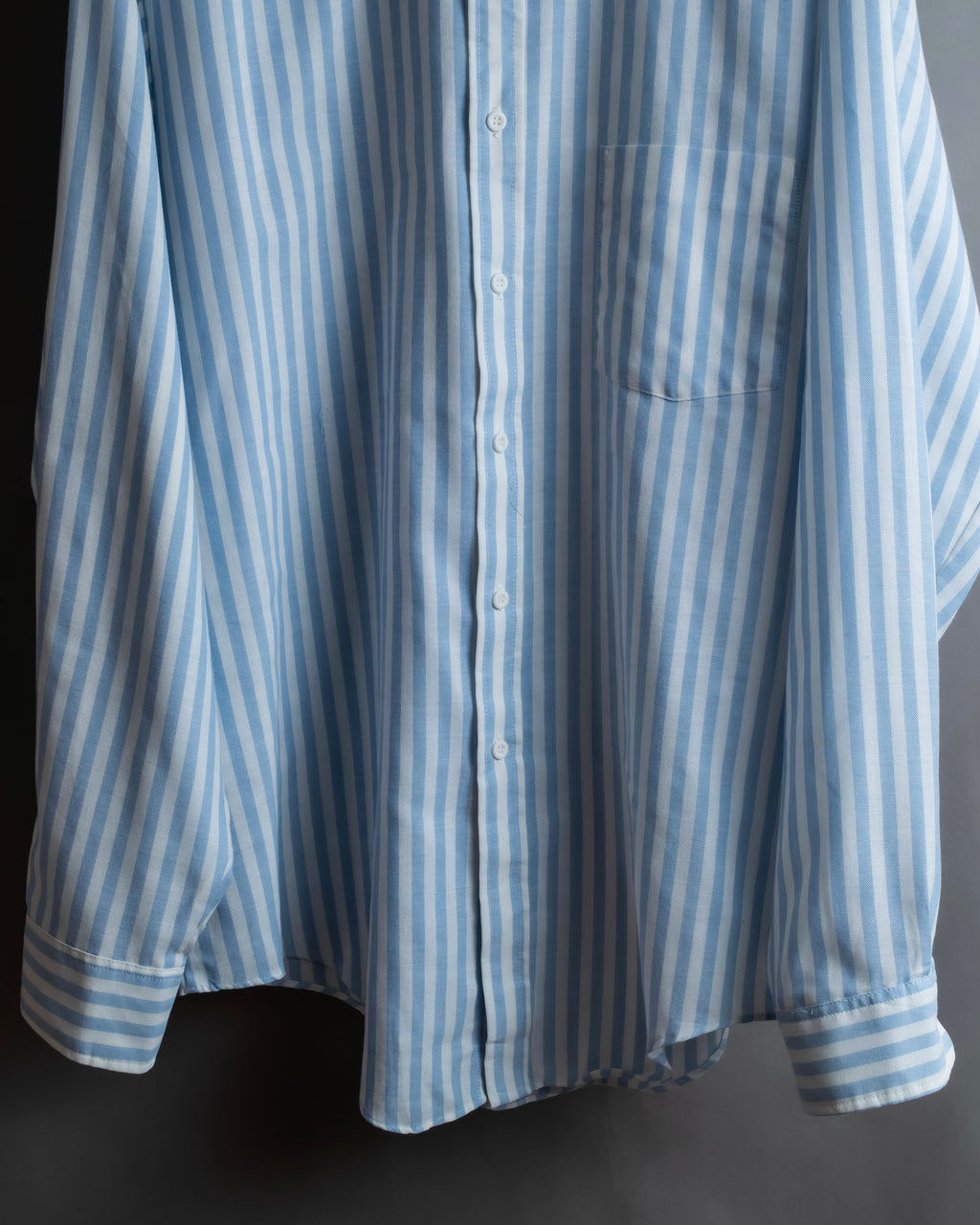 "Vintage light blue striped button-down shirt"