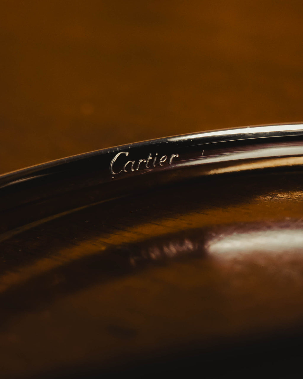 "Cartier" 80's Sculptural ring-handle leather wallet