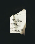 内側に配された多国表記の品質表示タグ。サイズ40、モデル番号、製造者MAXMARA S.R.L.およびイタリア製の表記が確認できるカット。