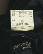 Yves Saint Laurent pour hommeのブランドタグと、表地が毛85％・カシミヤ15％であることを示す品質表示タグのカット。オンワード樫山および日本製の表記も確認できます。