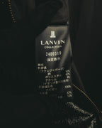 内側に配されたLANVIN COLLECTIONの品質表示タグ。前身頃のフクレジャガードに綿・ポリエステル・アクリルの混紡、前身頃別布にナイロンを使用していることが確認できます。