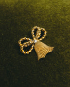 "Christian Dior" 80's-90's Gold tone ribbon tassel brooch
