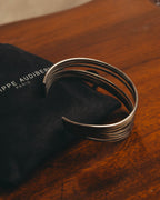 "PHILIPPE AUDIBERT" Sculptural silver tone cuff bracelet