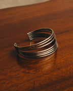 "PHILIPPE AUDIBERT" Sculptural silver tone cuff bracelet