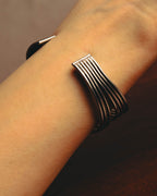 "PHILIPPE AUDIBERT" Sculptural silver tone cuff bracelet