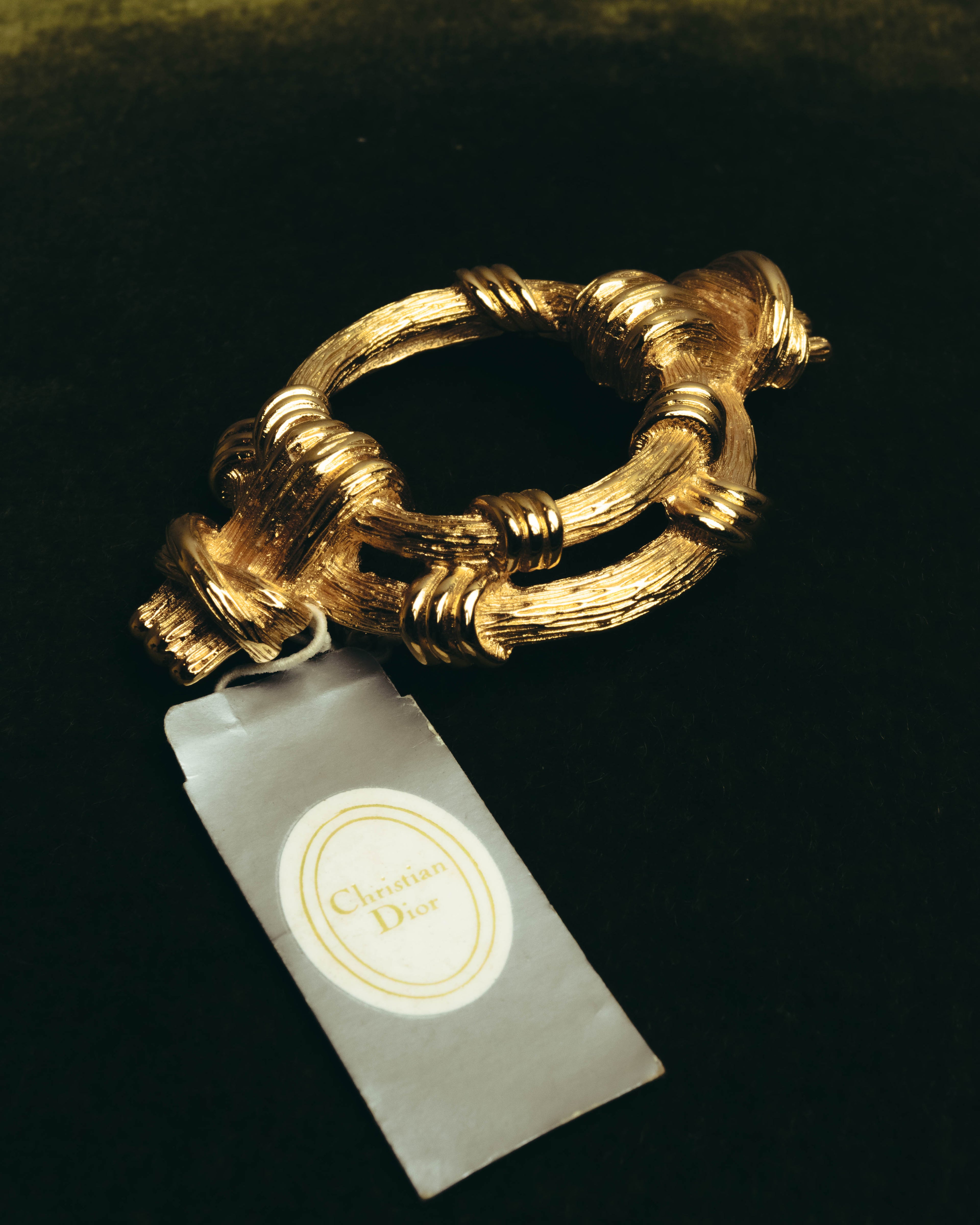 "Christian Dior" 80's-90's Sculptural gold tone ribbon brooch