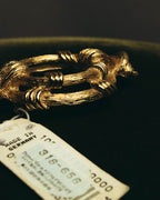 "Christian Dior" 80's-90's Sculptural gold tone ribbon brooch