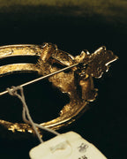 "Christian Dior" 80's-90's Sculptural gold tone ribbon brooch