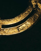 "Christian Dior" 80's-90's Sculptural gold tone ribbon brooch