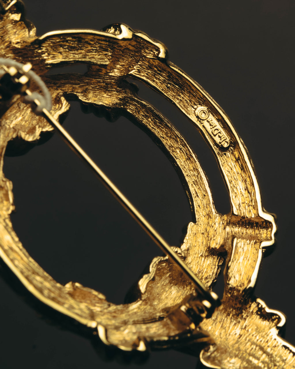 "Christian Dior" 80's-90's Sculptural gold tone ribbon brooch