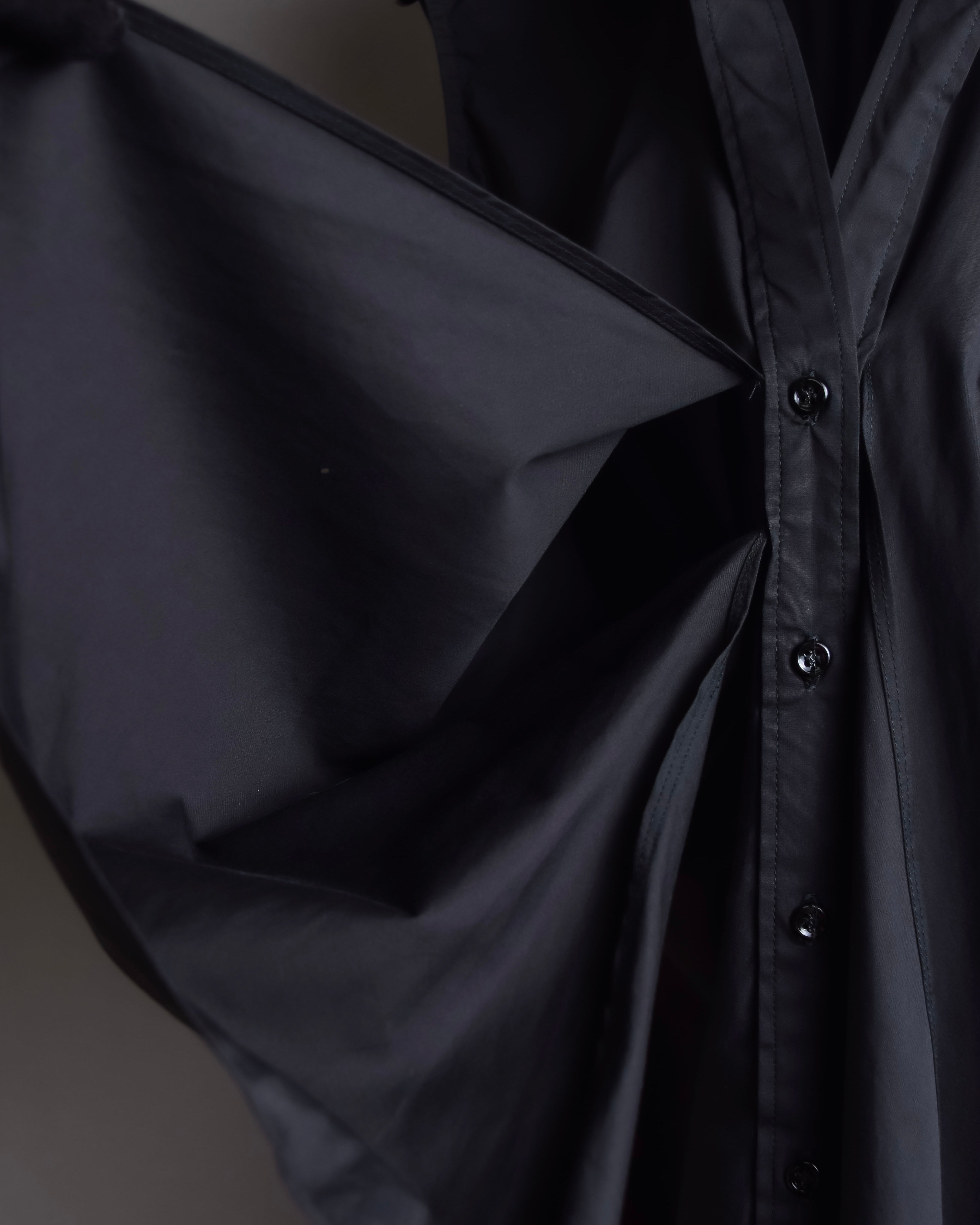 "Yves Saint Laurent Rive Gauche"
Twisted front sleeveless shirt