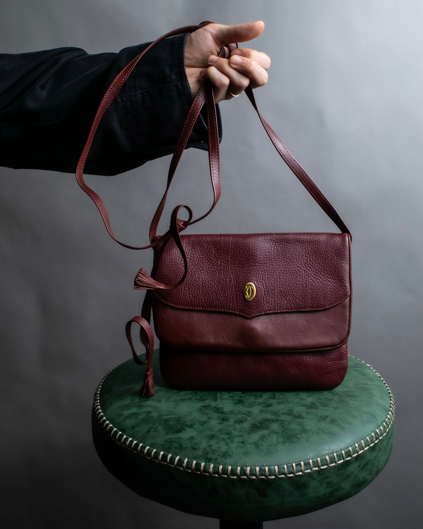 "Cartier" Texture changing bordeaux colored leather shoulder bag