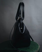 "Y’s" 22AW sculptural kiss-lock leather bag