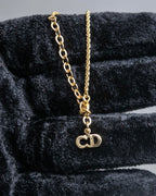 "Christian Dior" Rhinestone studded CD logo design in gold necklace