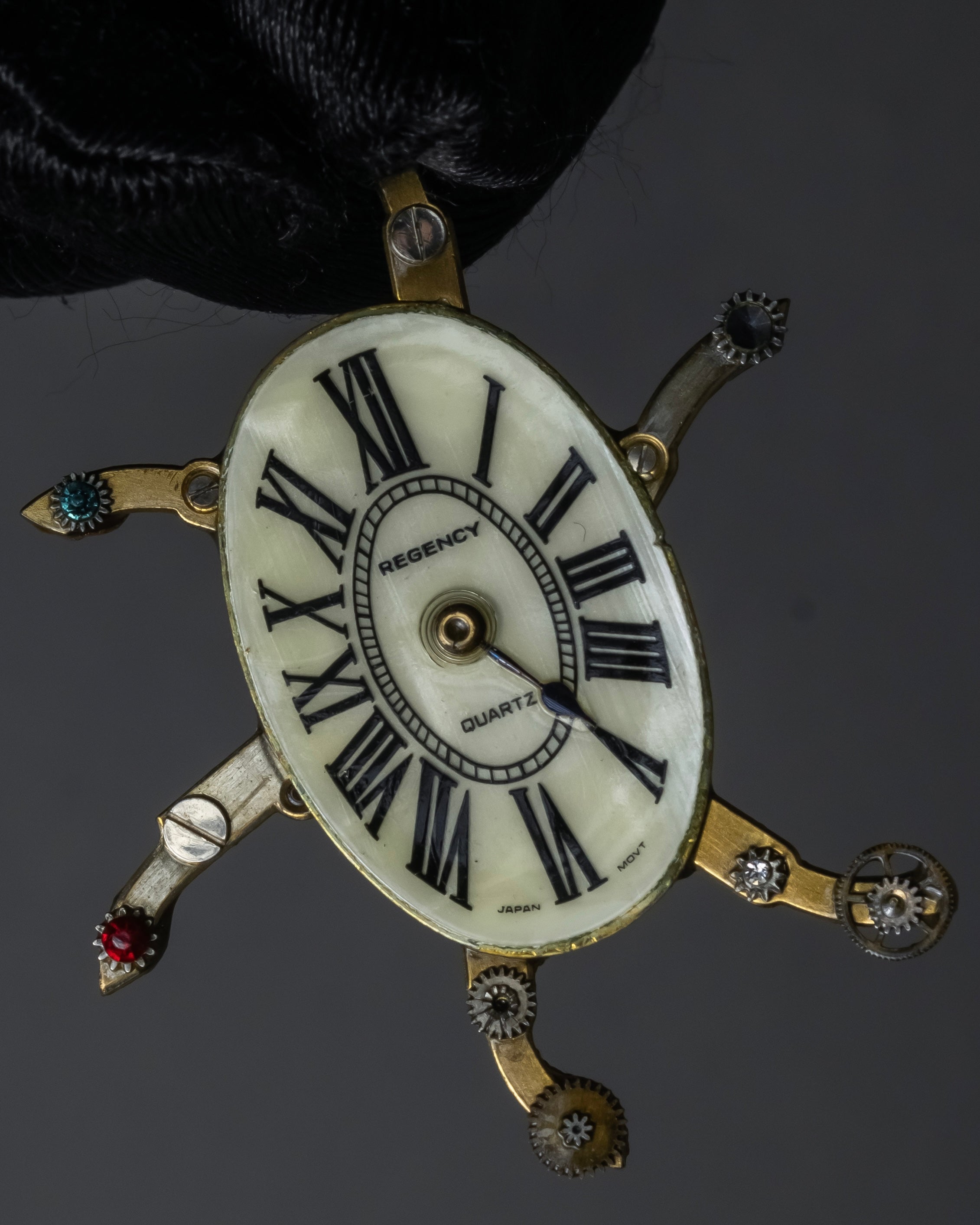 "Jerry Robertson design clock motif brooch"