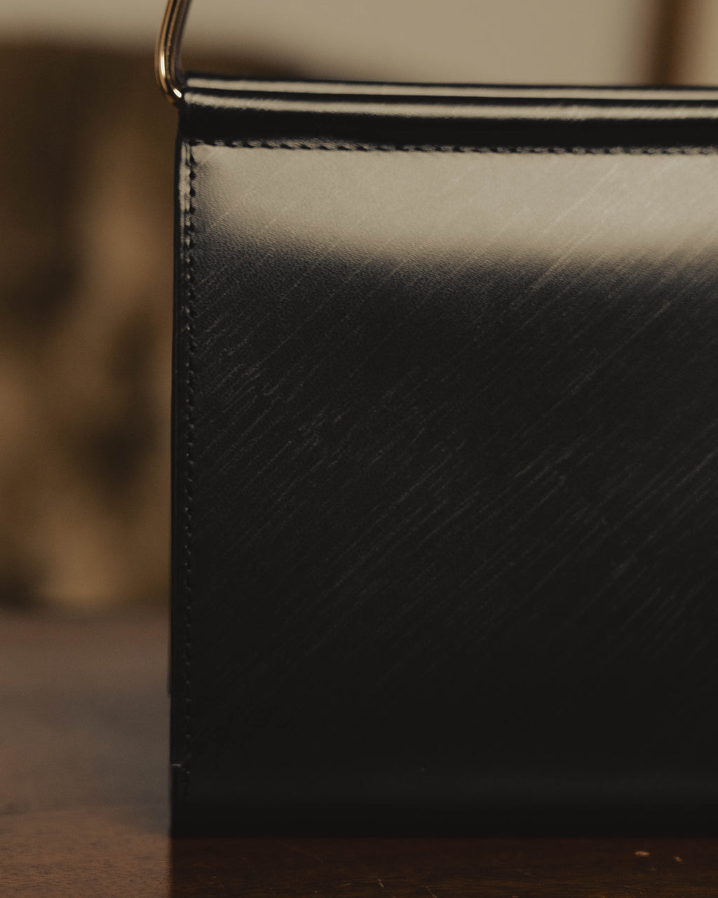"Cartier" 80's Sculptural ring-handle leather wallet