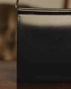 "Cartier" 80's Sculptural ring-handle leather wallet