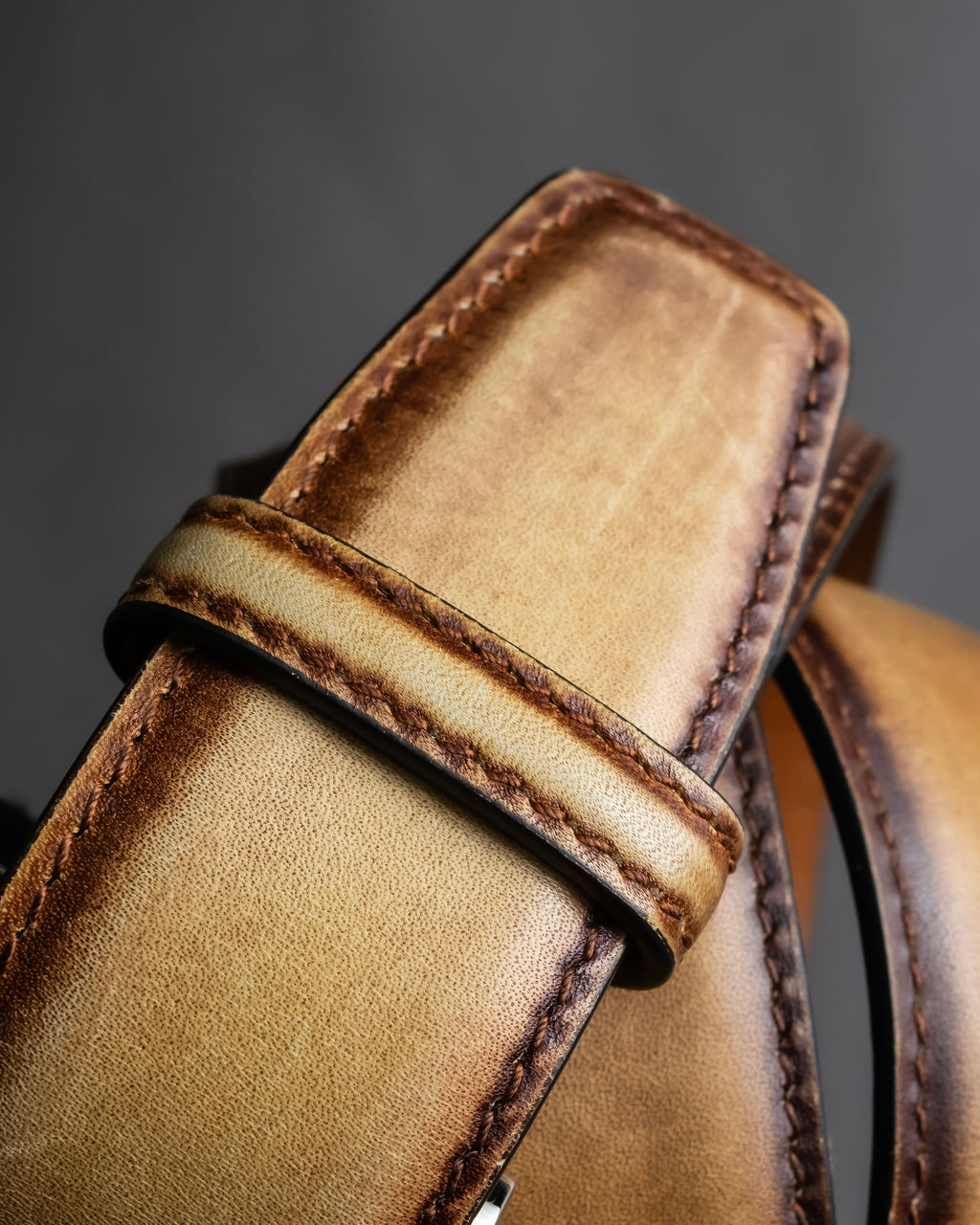 "Berluti" Patina finish curved buckle leather belt