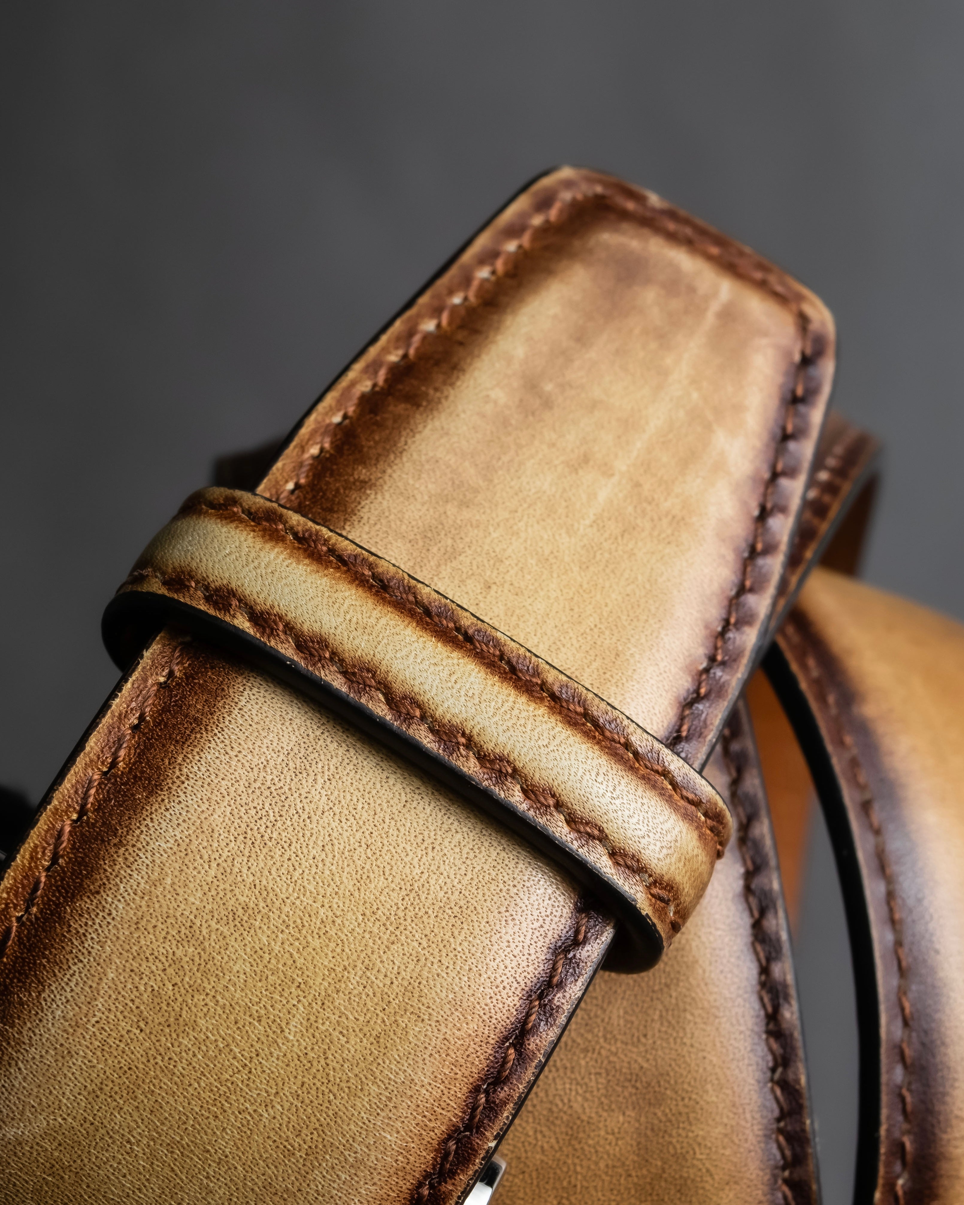 "Berluti" Patina finish curved buckle leather belt